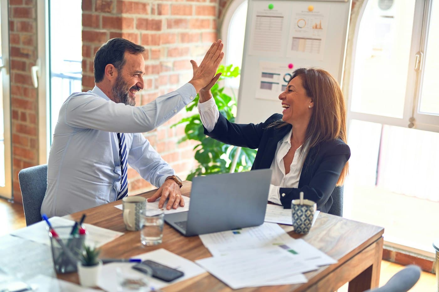 Colleagues celebrating together in an office